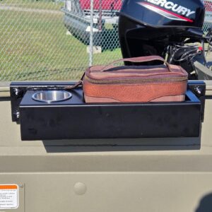 Boat motor with tray and brown bag.