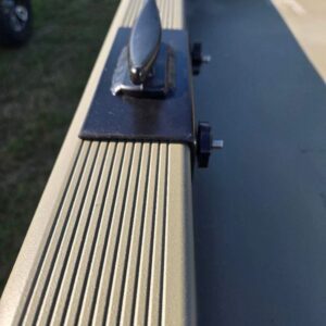 Boat cleat on ribbed metal surface.