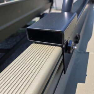 Metal bracket attached to a boat rail.