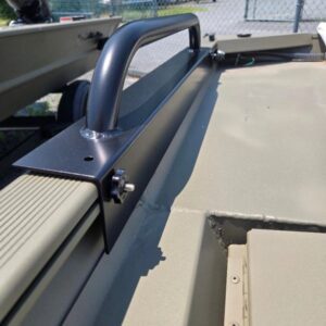 Metal handle on a military vehicle surface.