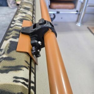 Boat rail with camouflage pattern and clamp.